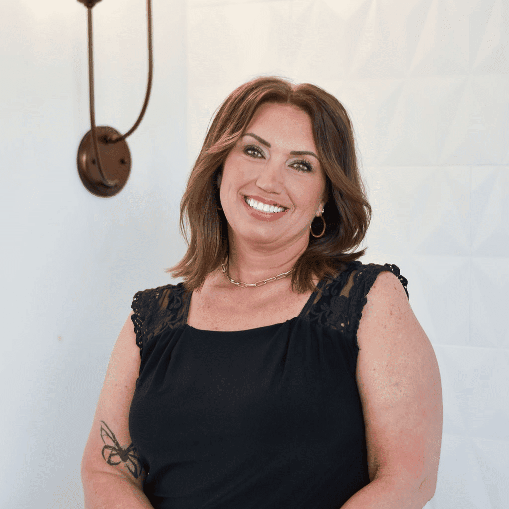 Portrait of Jennifer, a professional stylist at Bonjour Belle Salon, showcasing their expertise and style.