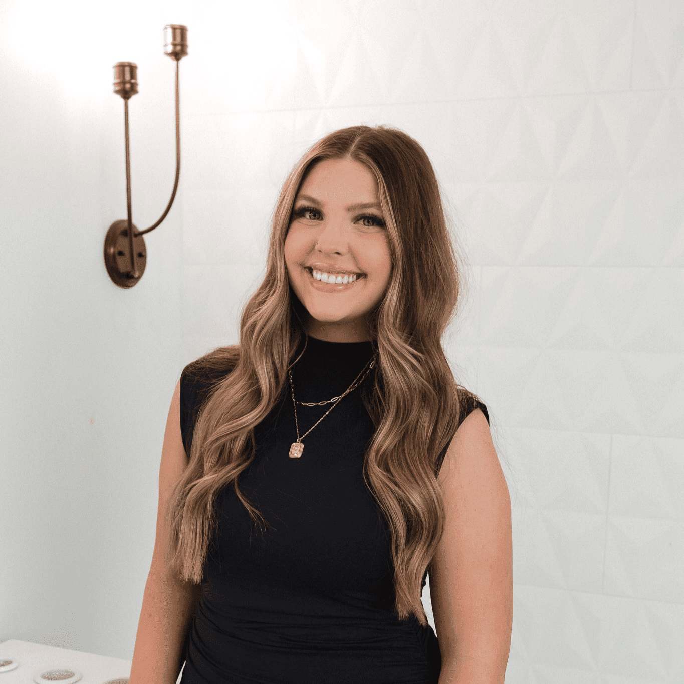 Portrait of Chloe, a professional stylist at Bonjour Belle Salon, showcasing their expertise and style.