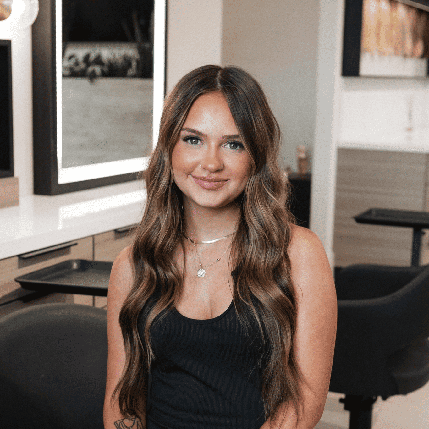 Portrait of Emily, a professional stylist at Bonjour Belle Salon, showcasing their expertise and style.