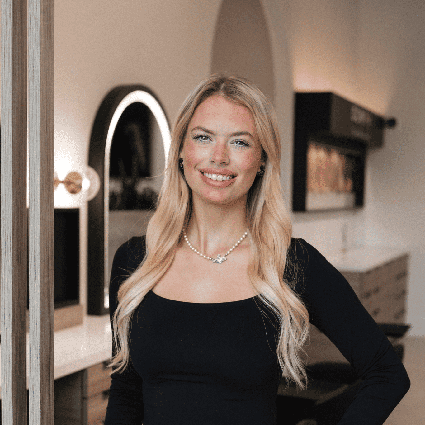 Portrait of Summer, a professional stylist at Bonjour Belle Salon, showcasing their expertise and style.