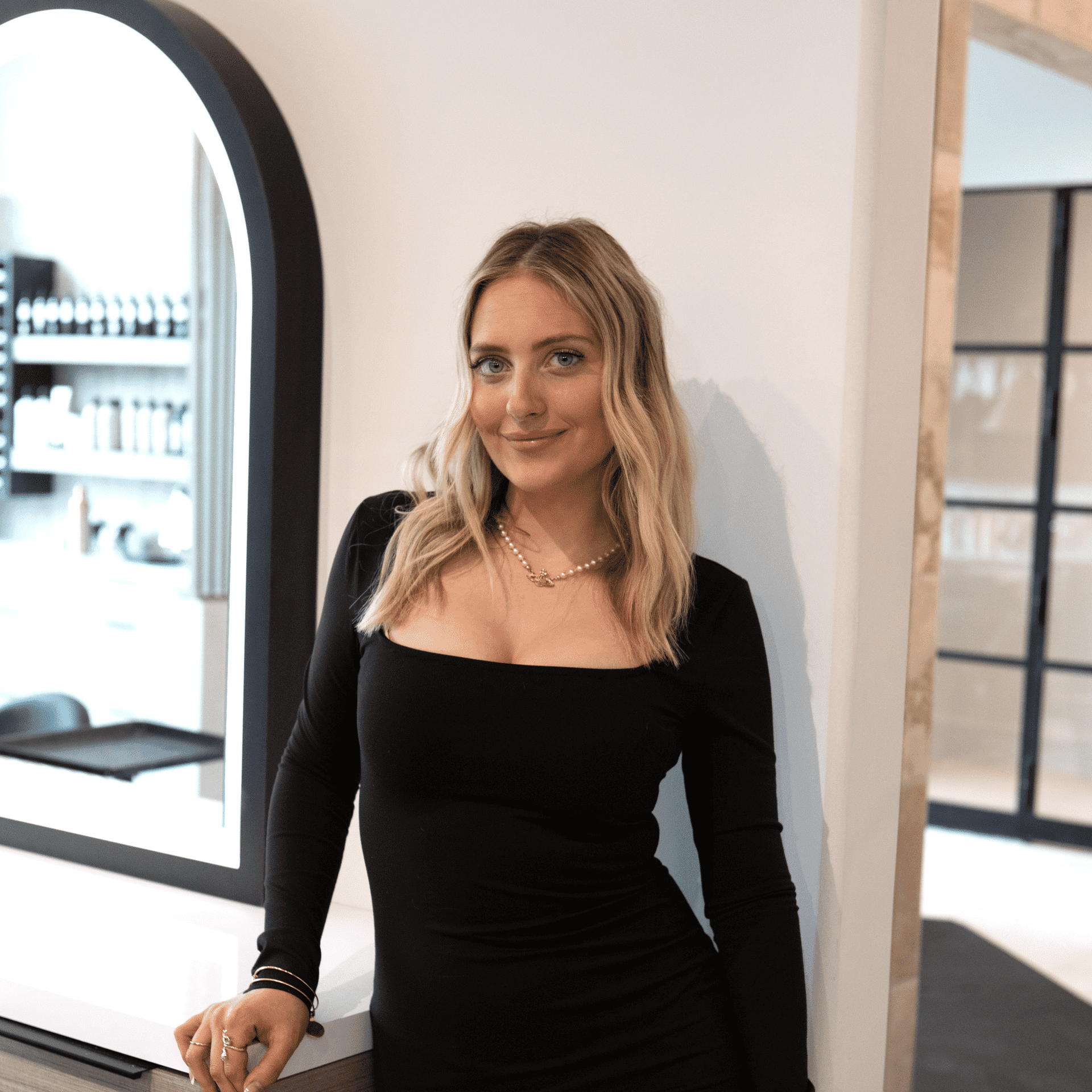 Portrait of Hannah, a professional stylist at Bonjour Belle Salon, showcasing their expertise and style.