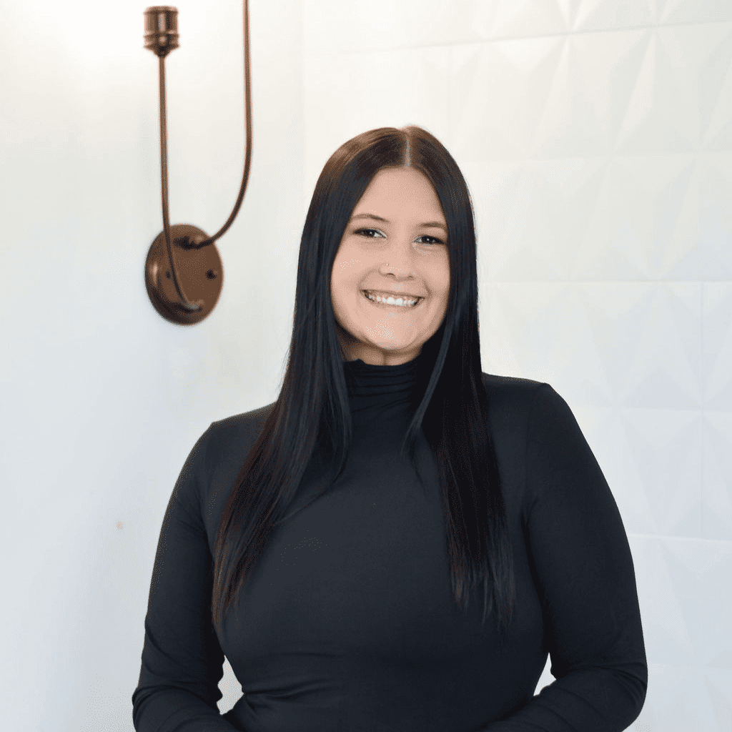 Portrait of Brooklyn, a professional stylist at Bonjour Belle Salon, showcasing their expertise and style.
