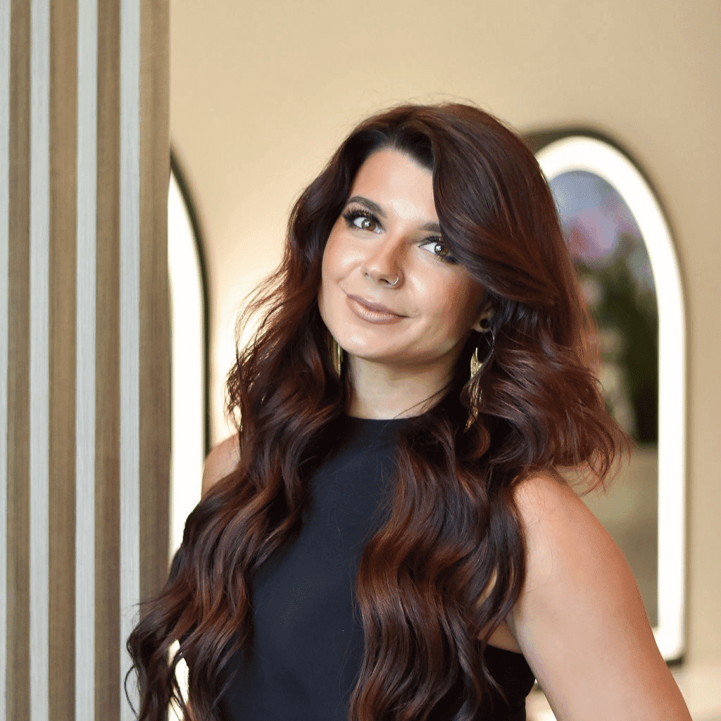 Portrait of Ashley, a professional stylist at Bonjour Belle Salon, showcasing their expertise and style.