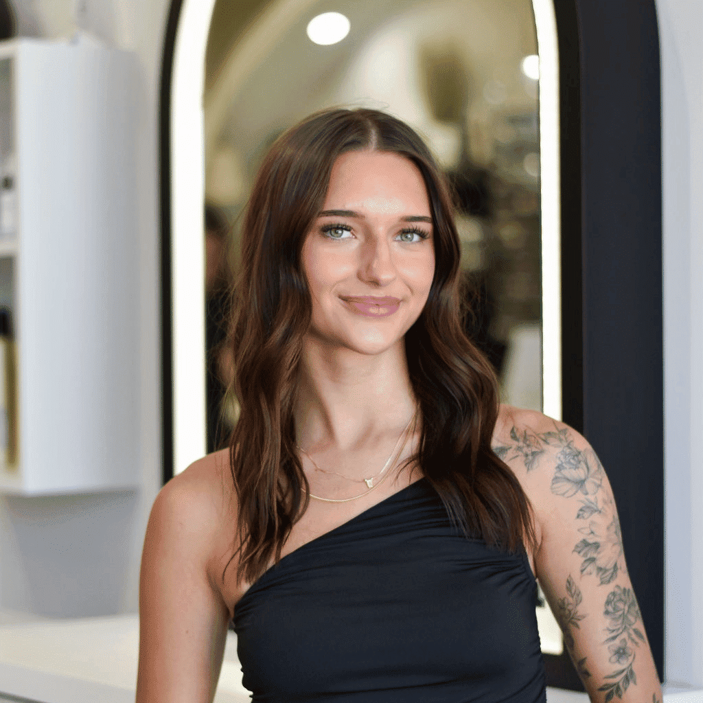 Portrait of Olivia, a professional stylist at Bonjour Belle Salon, showcasing their expertise and style.